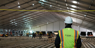 Heritage worker accessing the fabricated sheet metal solution for Stony Brook University Hospital’s temporary, emergency COVID-19 center